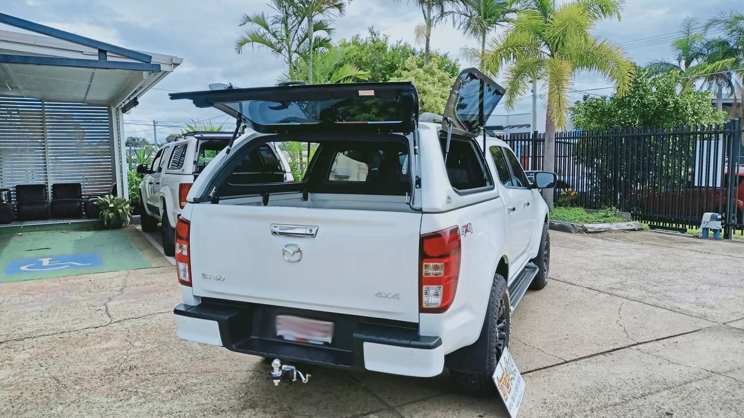Mazda BT50 2020+ with Trek Canopy in Code 527 Ice White - rear view - open windows
